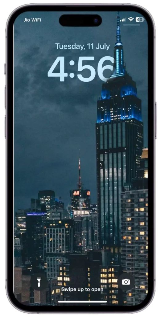 ios 16 depth wallpapers with the illuminated buildings that rise against the night sky, casting a captivating glow.
