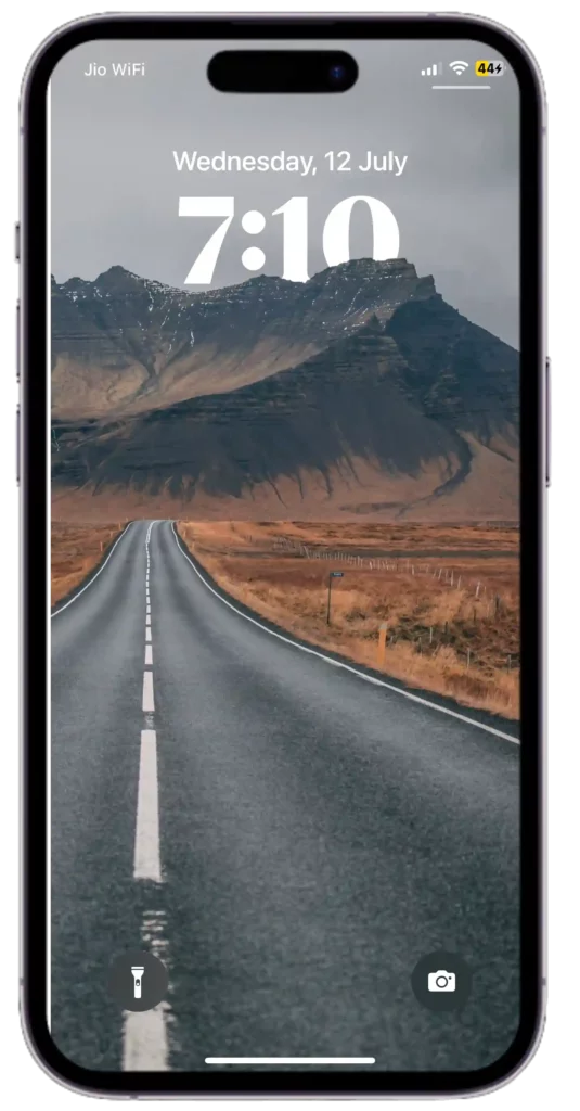 iPhone depth effect wallpaper with showcasing mountains and a winding road. 